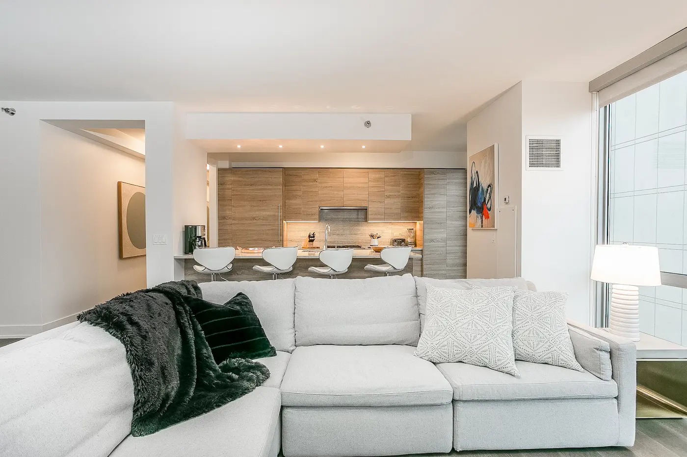 Group of professionals enjoying a luxury furnished corporate apartment in Downtown Chicago.